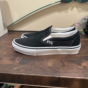 Vans Black and White Slip-On Sneakers